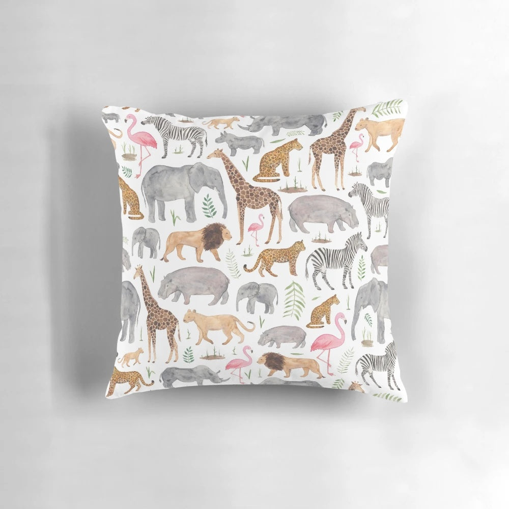 A colorful watercolor-style pattern featuring various safari animals like giraffes, zebras, and elephants on a throw pillow.