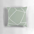 Sage green throw pillow with a geometric, minimalist design inspired by Moroccan patterns and tiles.