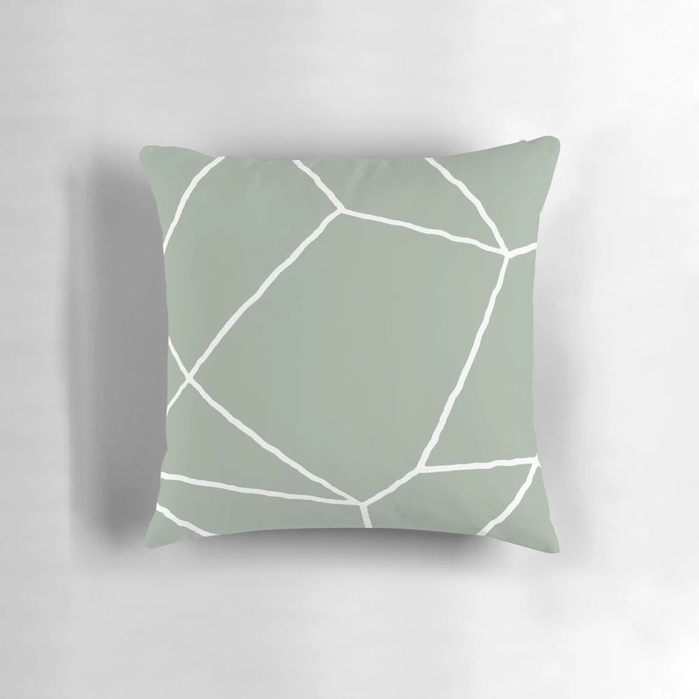 Sage green throw pillow with a geometric, minimalist design inspired by Moroccan patterns and tiles.