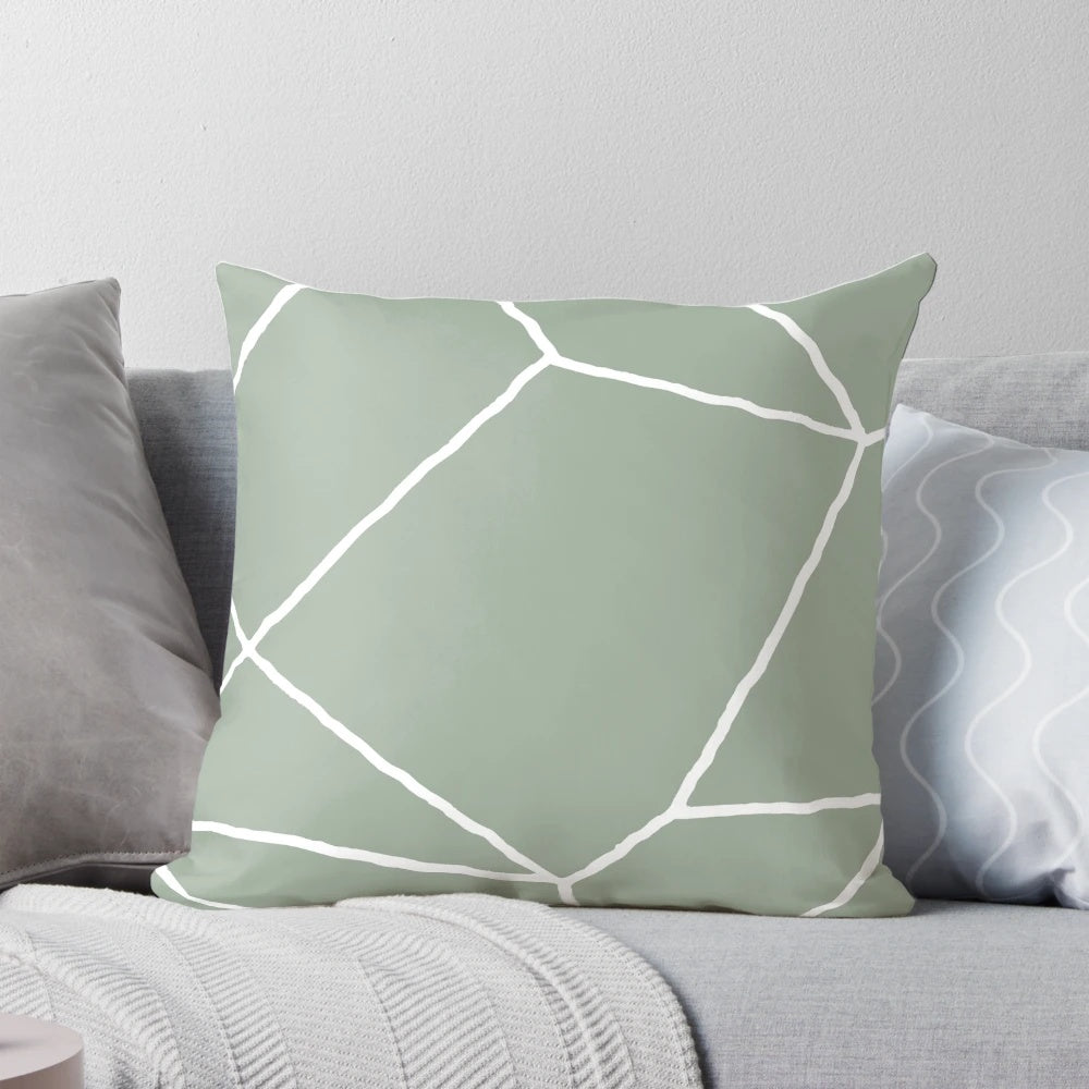 Sage green throw pillow with a geometric, minimalist design inspired by Moroccan patterns and tiles.