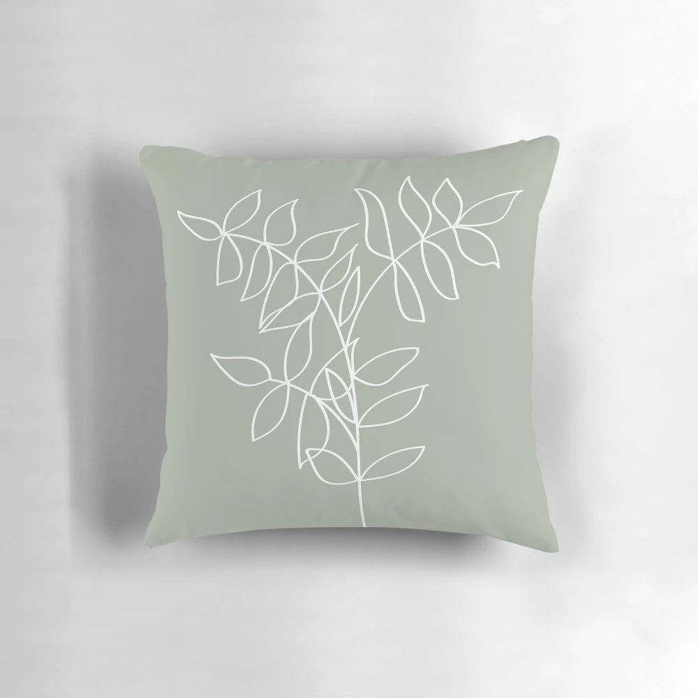 Sage green pillow with a minimalist plant line art illustration, ideal for boho and Scandinavian-inspired home decor.