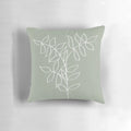 Sage green pillow with a minimalist plant line art illustration, ideal for boho and Scandinavian-inspired home decor.