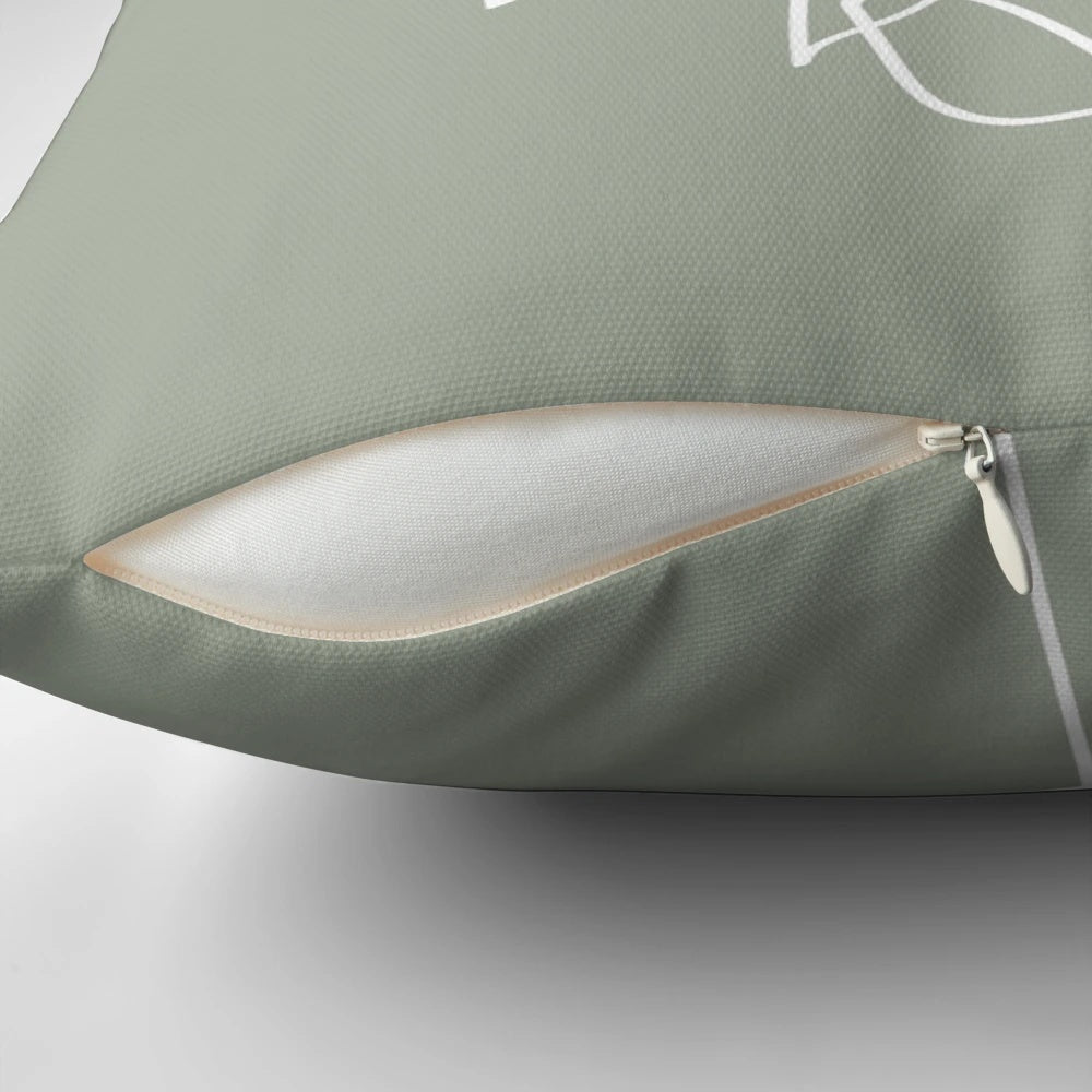 Sage green pillow with a minimalist plant line art illustration, ideal for boho and Scandinavian-inspired home decor.