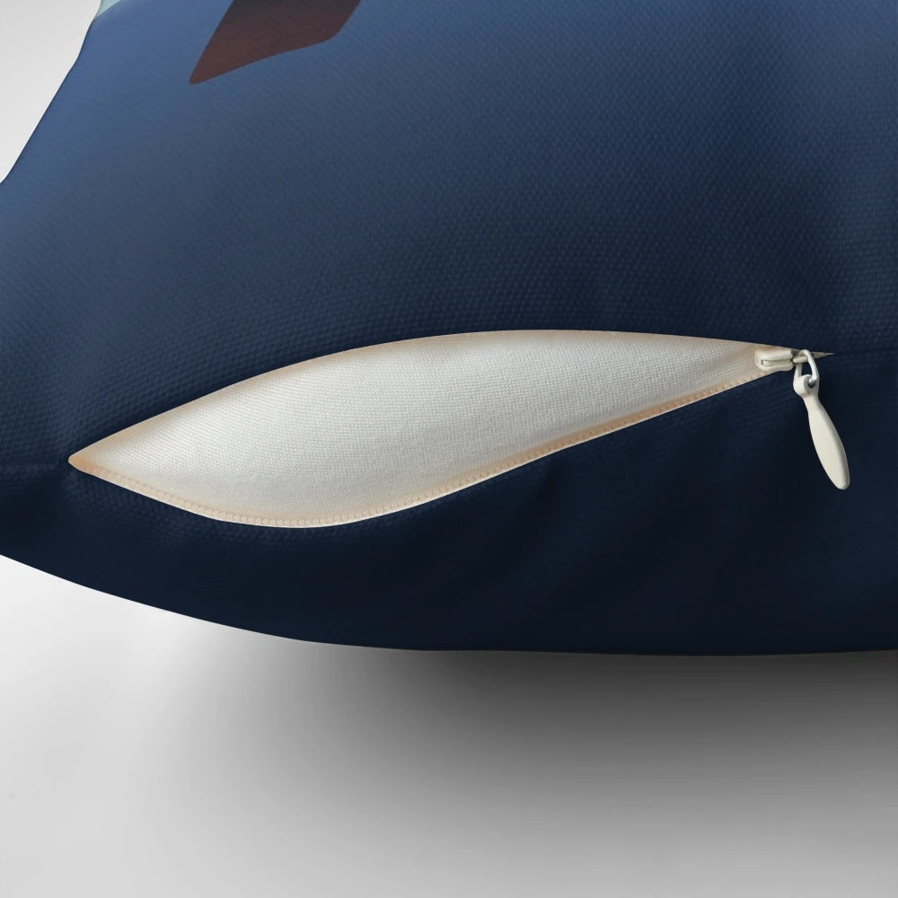 Decorative nautical-themed pillow featuring a stylized illustration of a boat sailing on the open sea