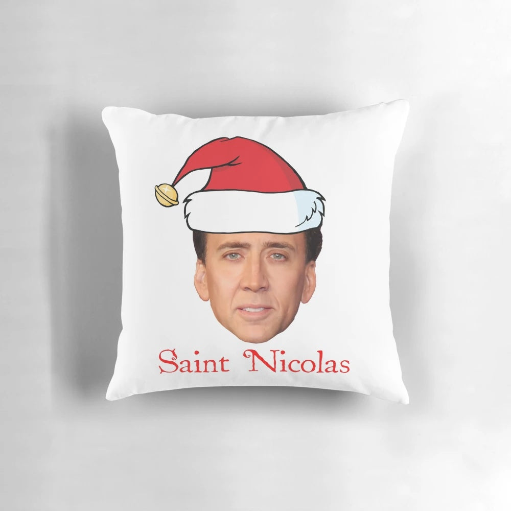 A festive pillow featuring the face of actor Nicholas Cage in a Santa-inspired design.