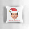 A festive pillow featuring the face of actor Nicholas Cage in a Santa-inspired design.