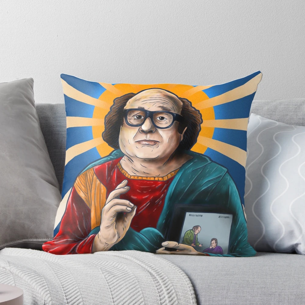 An image of a decorative pillow featuring the iconic actor Danny DeVito, depicted as a saintly figure.