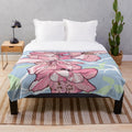 Soft and plush blanket featuring a beautiful sakura or cherry blossom design