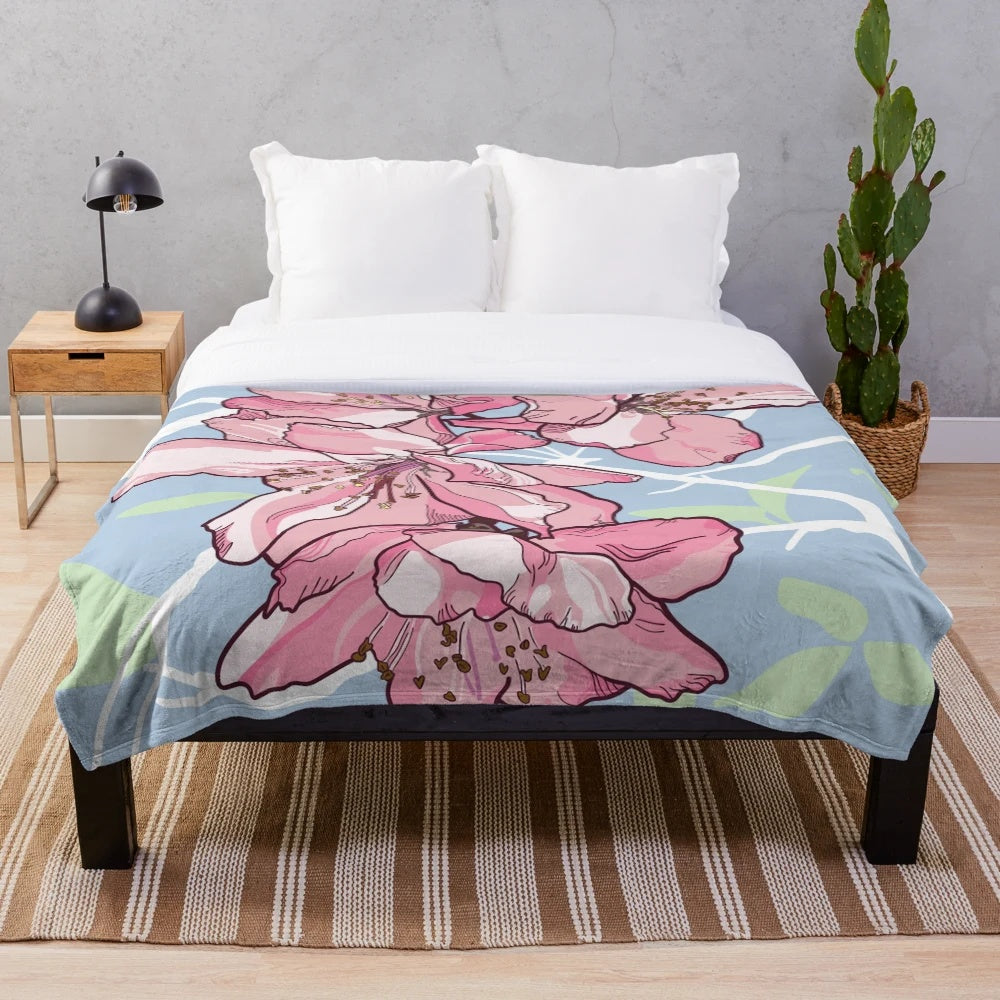 Soft and plush blanket featuring a beautiful sakura or cherry blossom design