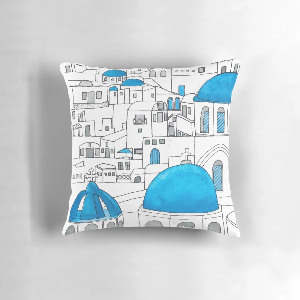 Santorini Blue and White Paradise Throw Pillow featuring an ink drawing and watercolor design of the iconic Greek island architecture.