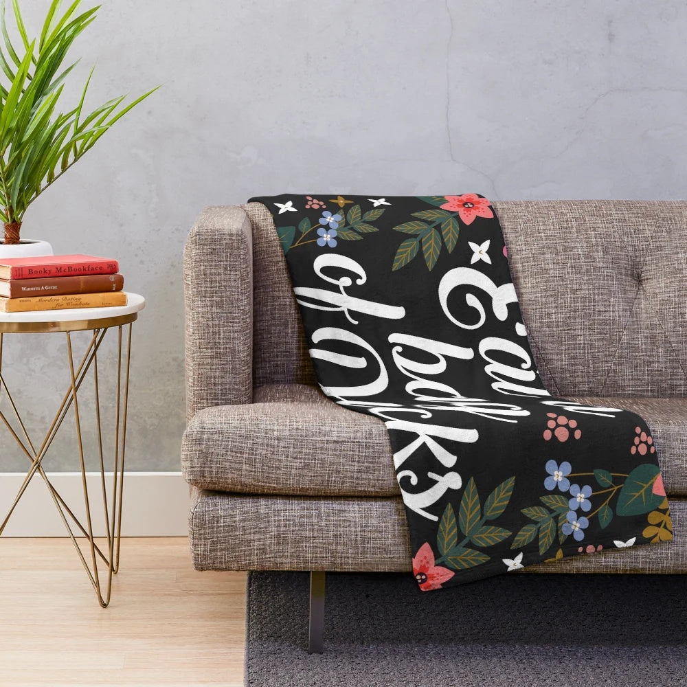 Sassy floral plush blanket with a humorous insulting quote