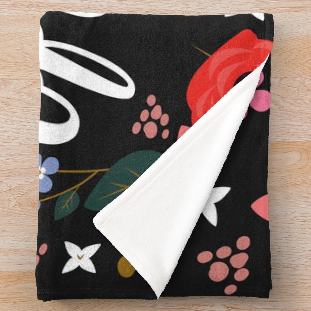 Sassy floral plush blanket with a humorous insulting quote