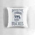 A sassy hand-lettered throw pillow with a skull and the text "Bring Me Pancakes