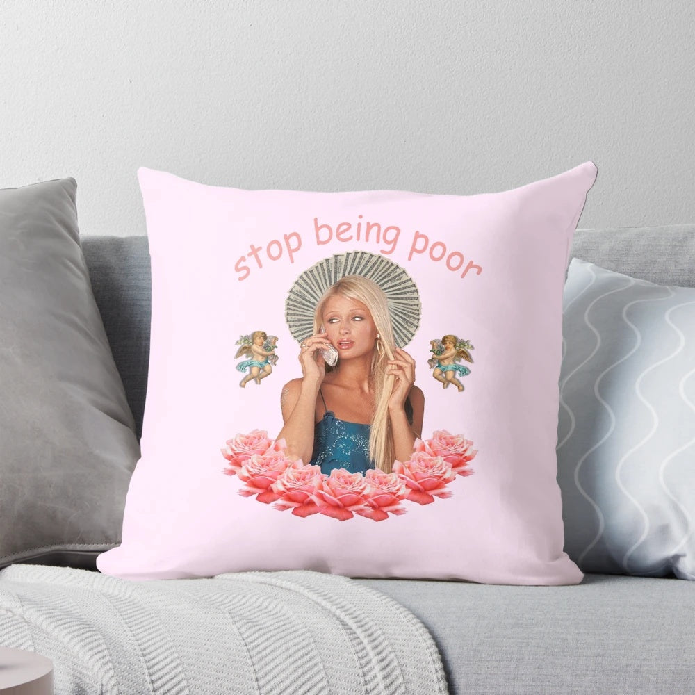 Satirical "Stop Being Poor" pillow with pop art inspired design featuring Paris Hilton