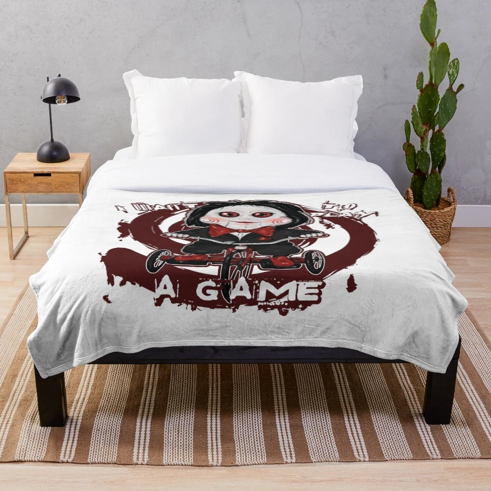 Saw-themed plush blanket with a kawaii tricycle design