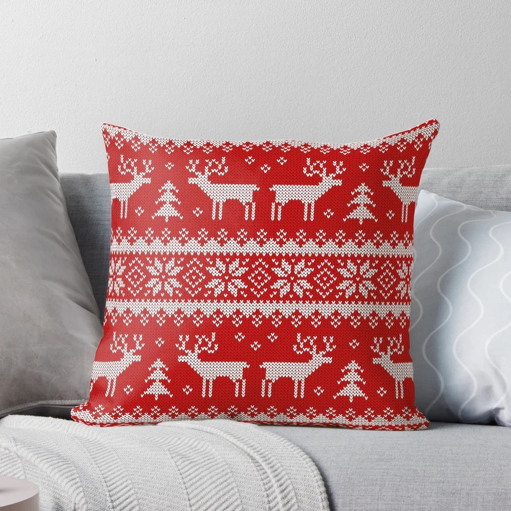 Pillow with a scandinavian-inspired pattern featuring deer and holiday elements in a cozy, winter-themed design.