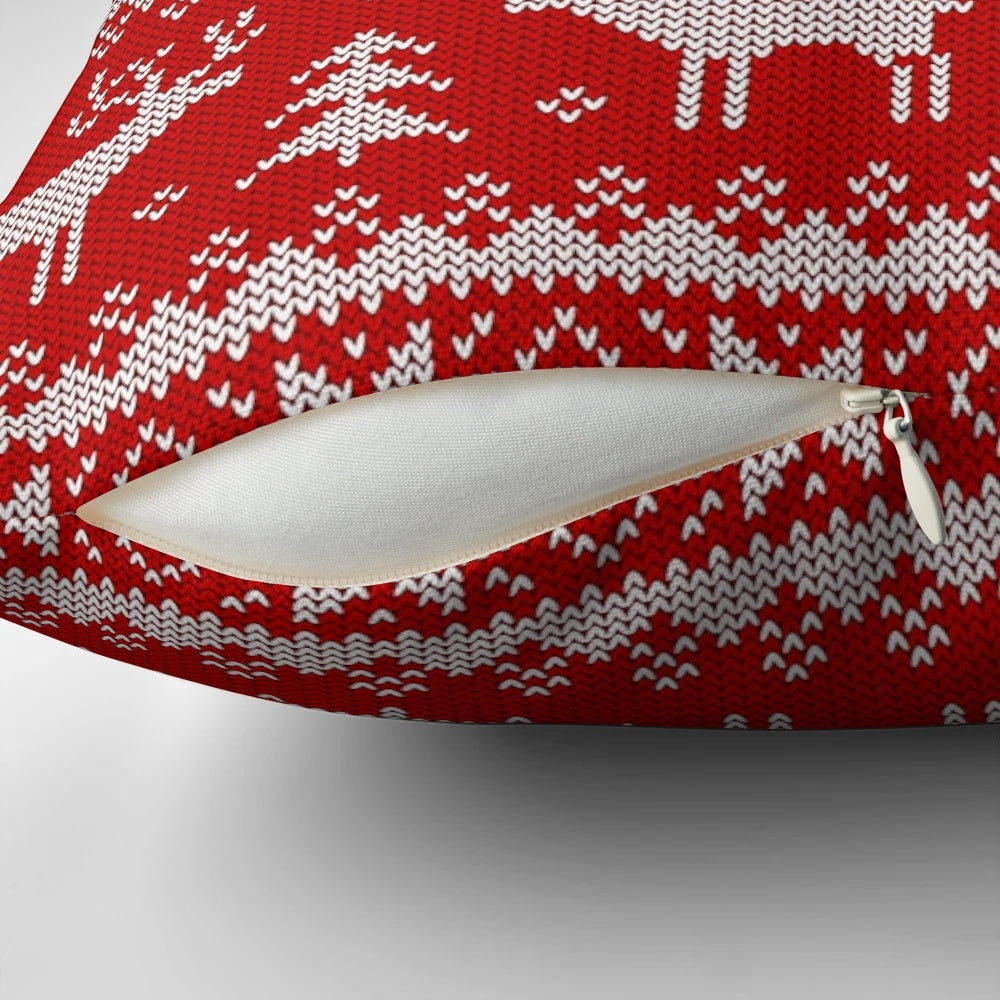 Pillow with a scandinavian-inspired pattern featuring deer and holiday elements in a cozy, winter-themed design.
