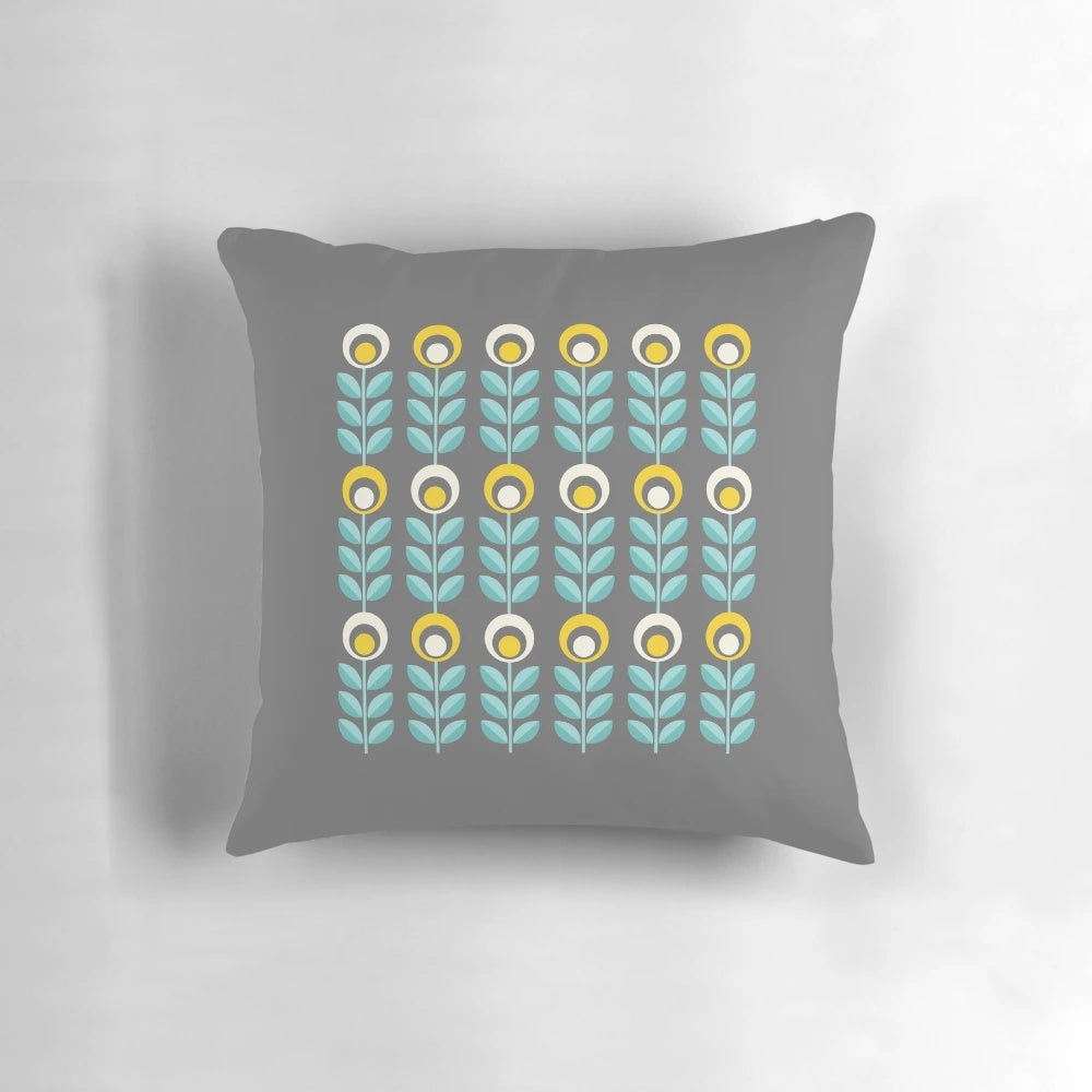 Stylish Scandinavian-inspired floral pattern pillow in shades of yellow, gray, and teal