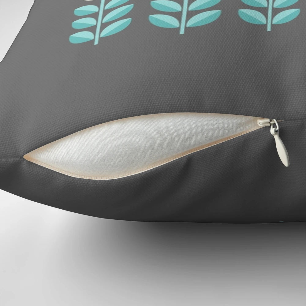 Stylish Scandinavian-inspired floral pattern pillow in shades of yellow, gray, and teal