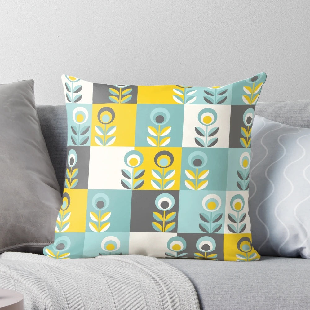 Scandinavian-inspired floral pattern pillow in shades of yellow, gray, and teal