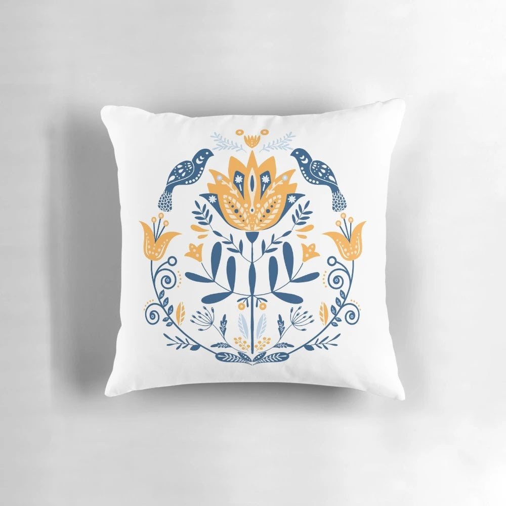 Stylish scandinavian folk art inspired cushion with mustard and blue flower pattern