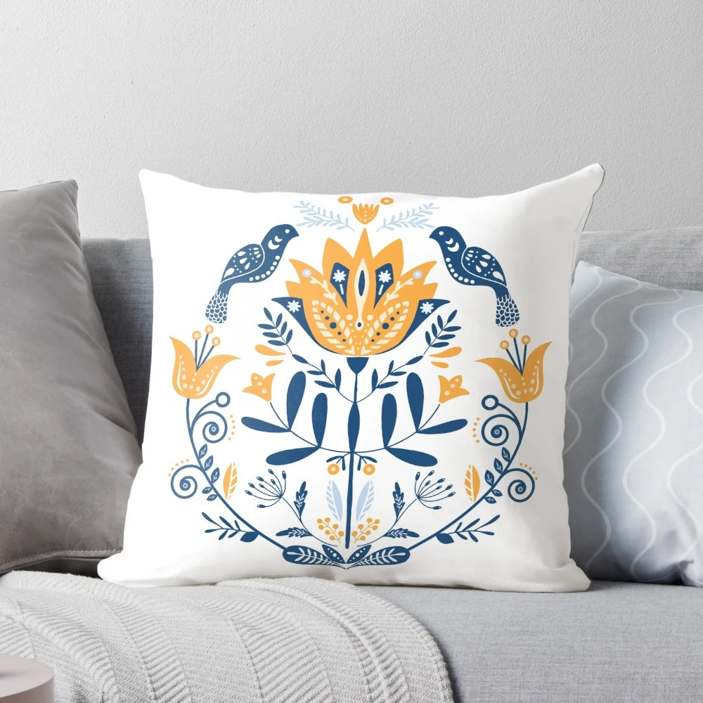 Stylish scandinavian folk art inspired cushion with mustard and blue flower pattern