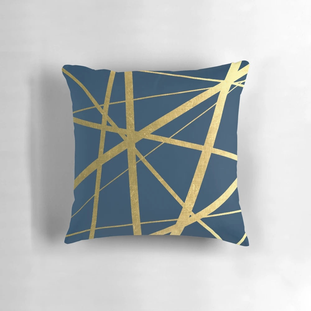 Scandinavian-inspired geometric navy and gold decorative pillow