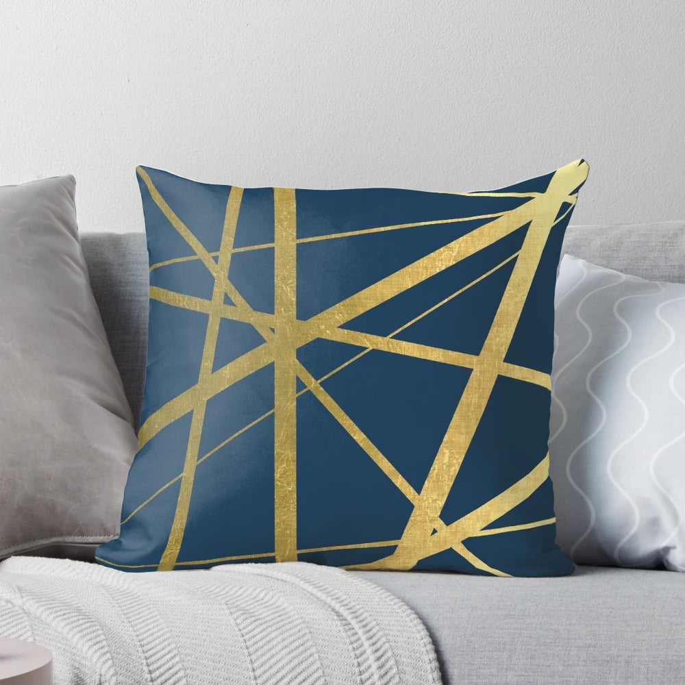 Scandinavian-inspired geometric navy and gold decorative pillow