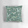 A folk floral dinosaur pattern pillows featuring a T-Rex, Brontosaurus, and Stegosaurus in a scandinavian-style design.