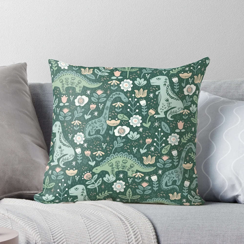 A folk floral dinosaur pattern pillows featuring a T-Rex, Brontosaurus, and Stegosaurus in a scandinavian-style design.