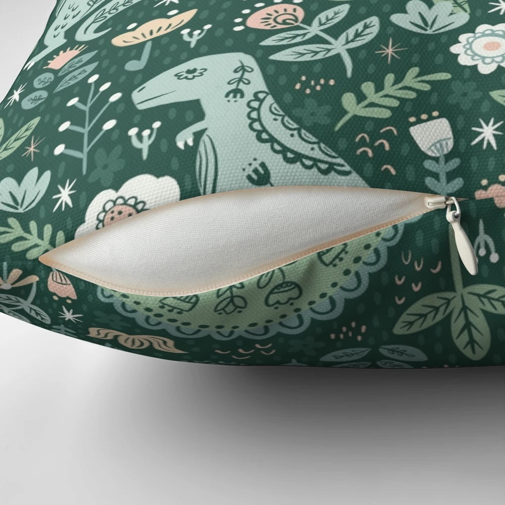 A folk floral dinosaur pattern pillows featuring a T-Rex, Brontosaurus, and Stegosaurus in a scandinavian-style design.