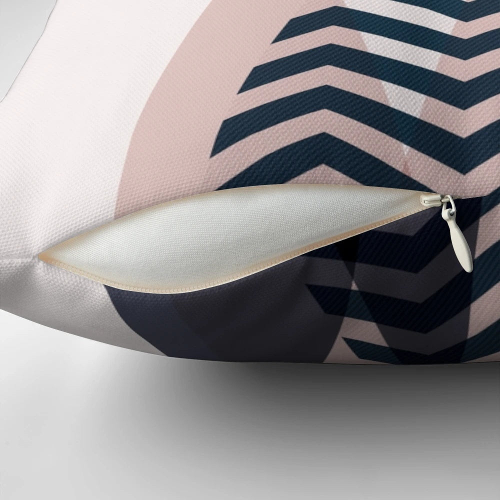 Scandinavian mountain peaks decorative throw pillow featuring a blush, navy, and blue color palette