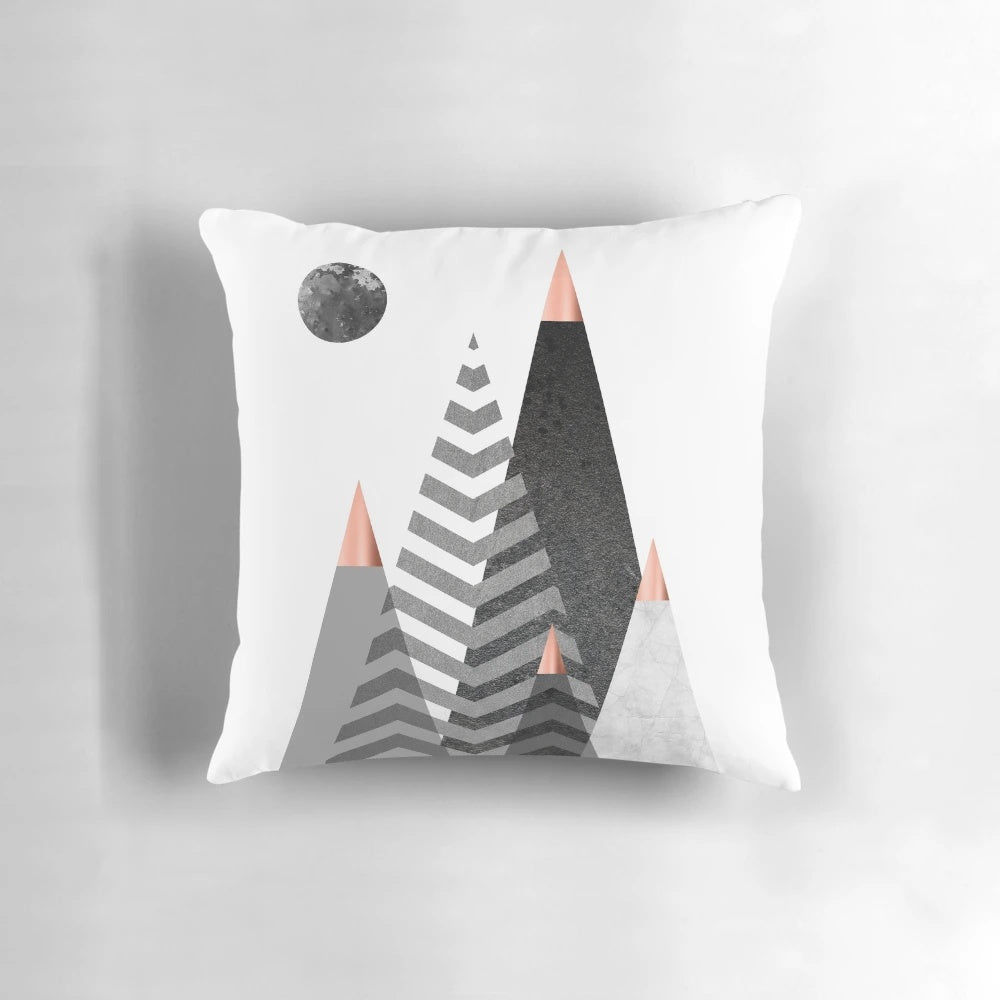 Scandinavian-inspired Nordic mountains design pillow with a minimalist, geometric black and white pattern