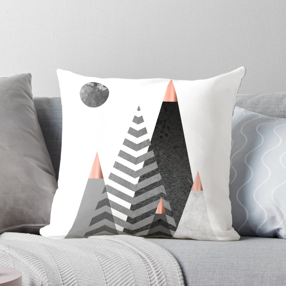 Scandinavian-inspired Nordic mountains design pillow with a minimalist, geometric black and white pattern