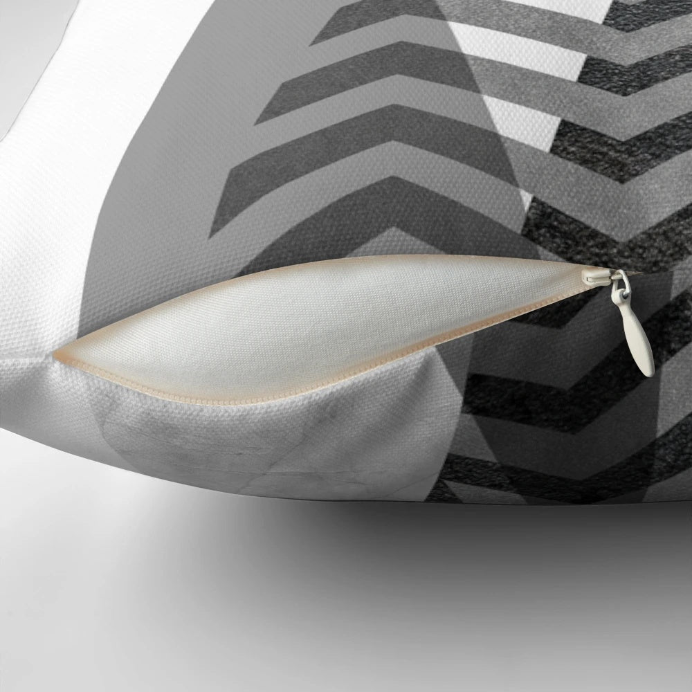 Scandinavian-inspired Nordic mountains design pillow with a minimalist, geometric black and white pattern