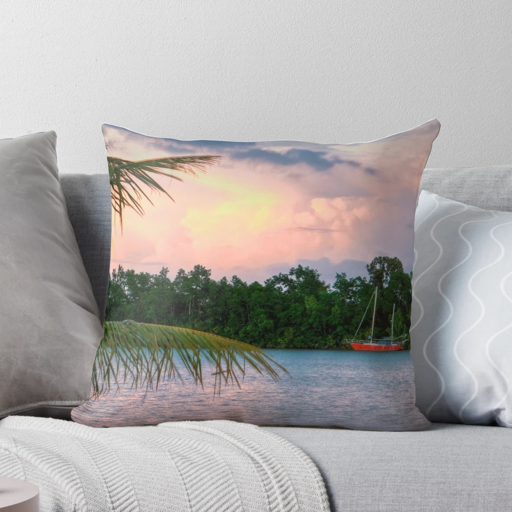 Photograph of a boat on a river in the tropical landscape of Innisfail, North Queensland, Australia