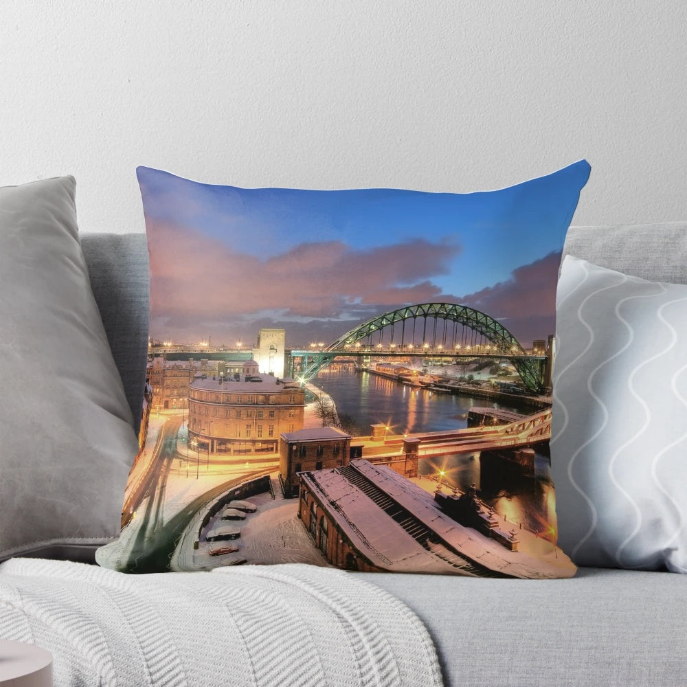 Picturesque view of the Tyne River bridge in Newcastle, UK during a snowy winter dawn