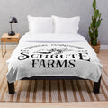 Schrute Farms Inspired Plush Blanket featuring the iconic logo and imagery from the popular TV show The Office