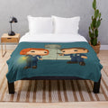 Plush blanket with Funko Pop dolls of Dana Scully and Fox Mulder from the X-Files