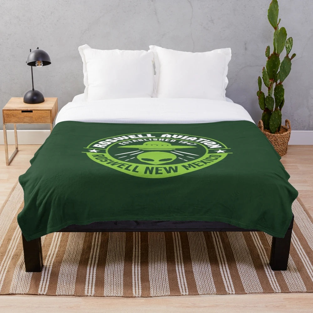 Roswell-inspired plush blanket featuring alien and UFO design