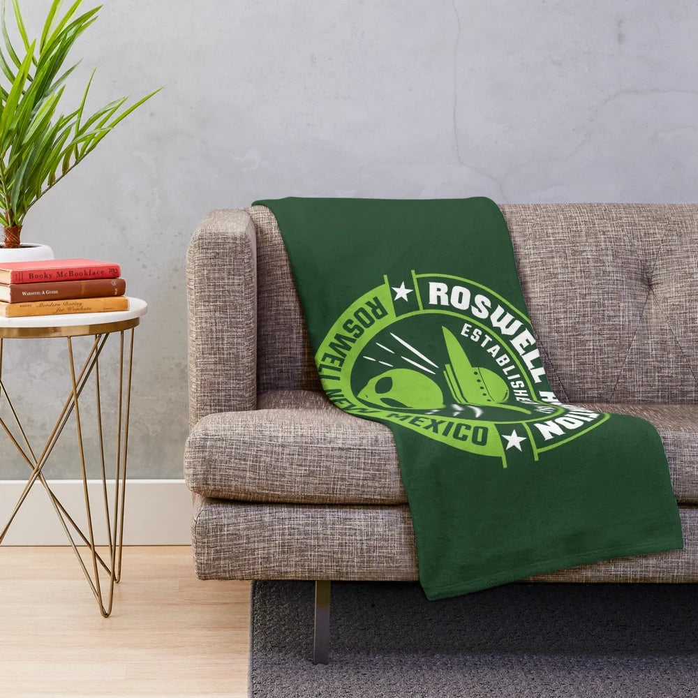 Roswell-inspired plush blanket featuring alien and UFO design