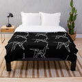 White plush blanket with origami unicorn design, inspired by the film Blade Runner