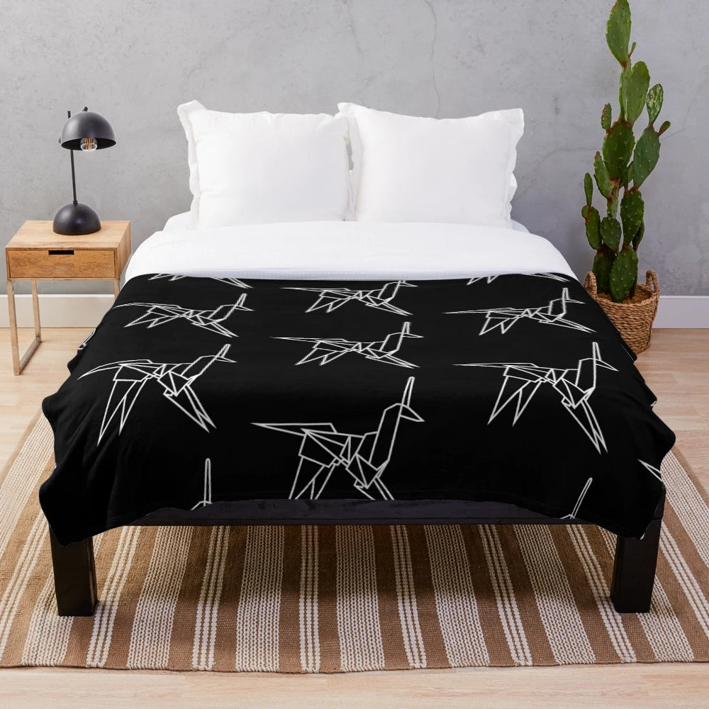 White plush blanket with origami unicorn design, inspired by the film Blade Runner