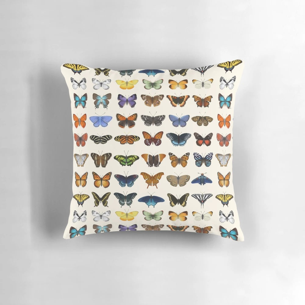 Decorative throw pillow featuring a detailed, scientifically accurate illustration of various butterfly species found in North America.