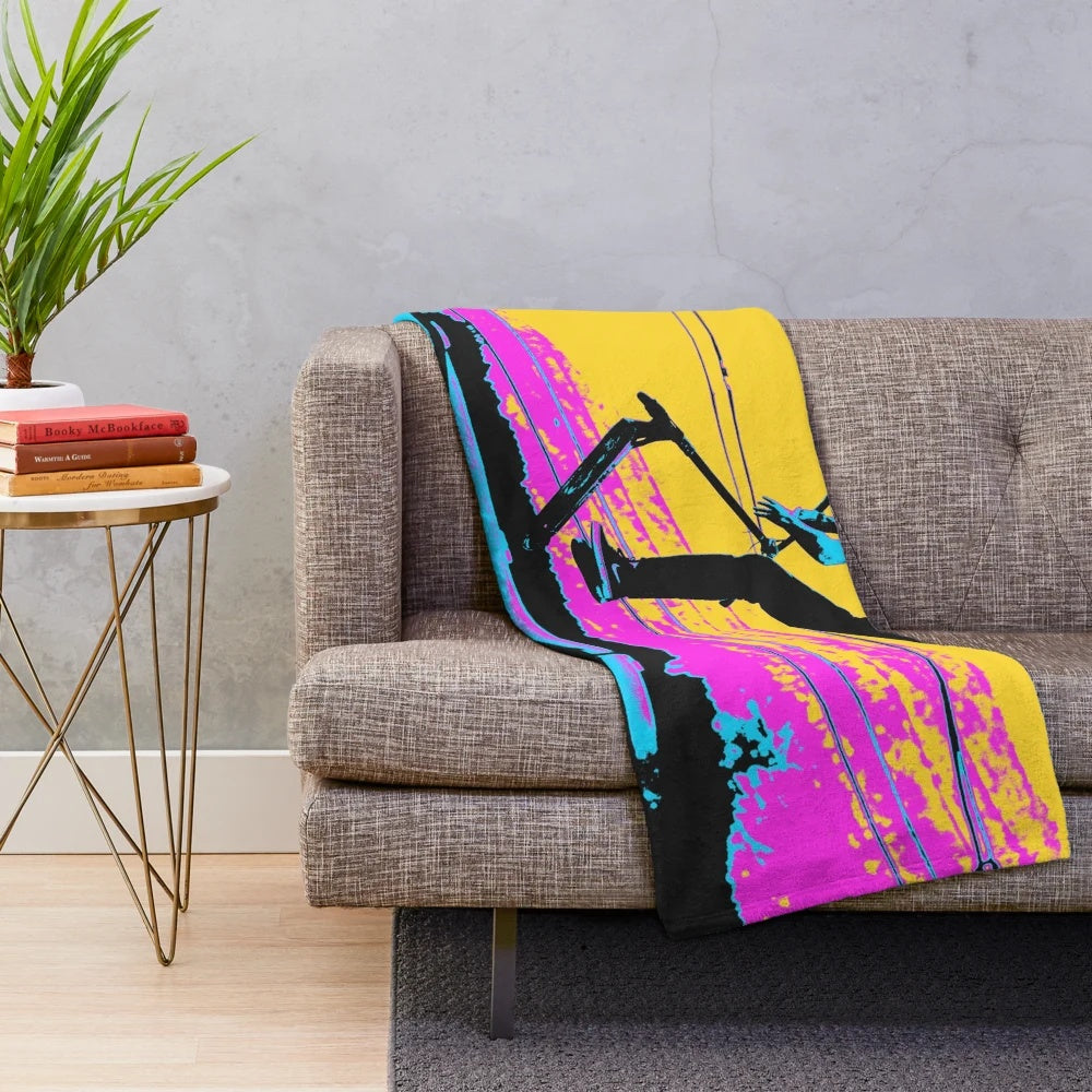 Plush blanket featuring a stunt scooter rider design