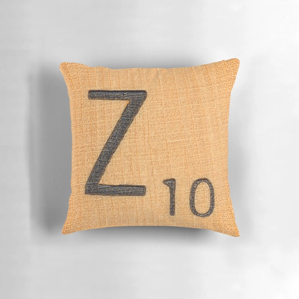 A white throw pillow with a large uppercase letter 'Z' in a classic scrabble font