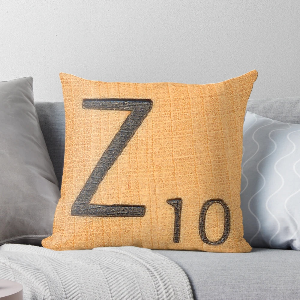 A white throw pillow with a large uppercase letter 'Z' in a classic scrabble font