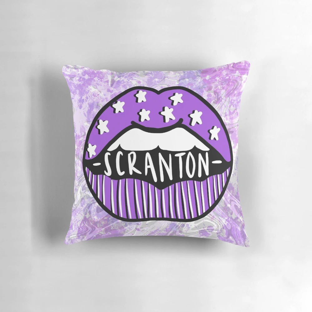 A vibrant tie-dye pillow featuring the Scranton Royals logo and purple lips, representing the University of Scranton in Pennsylvania.