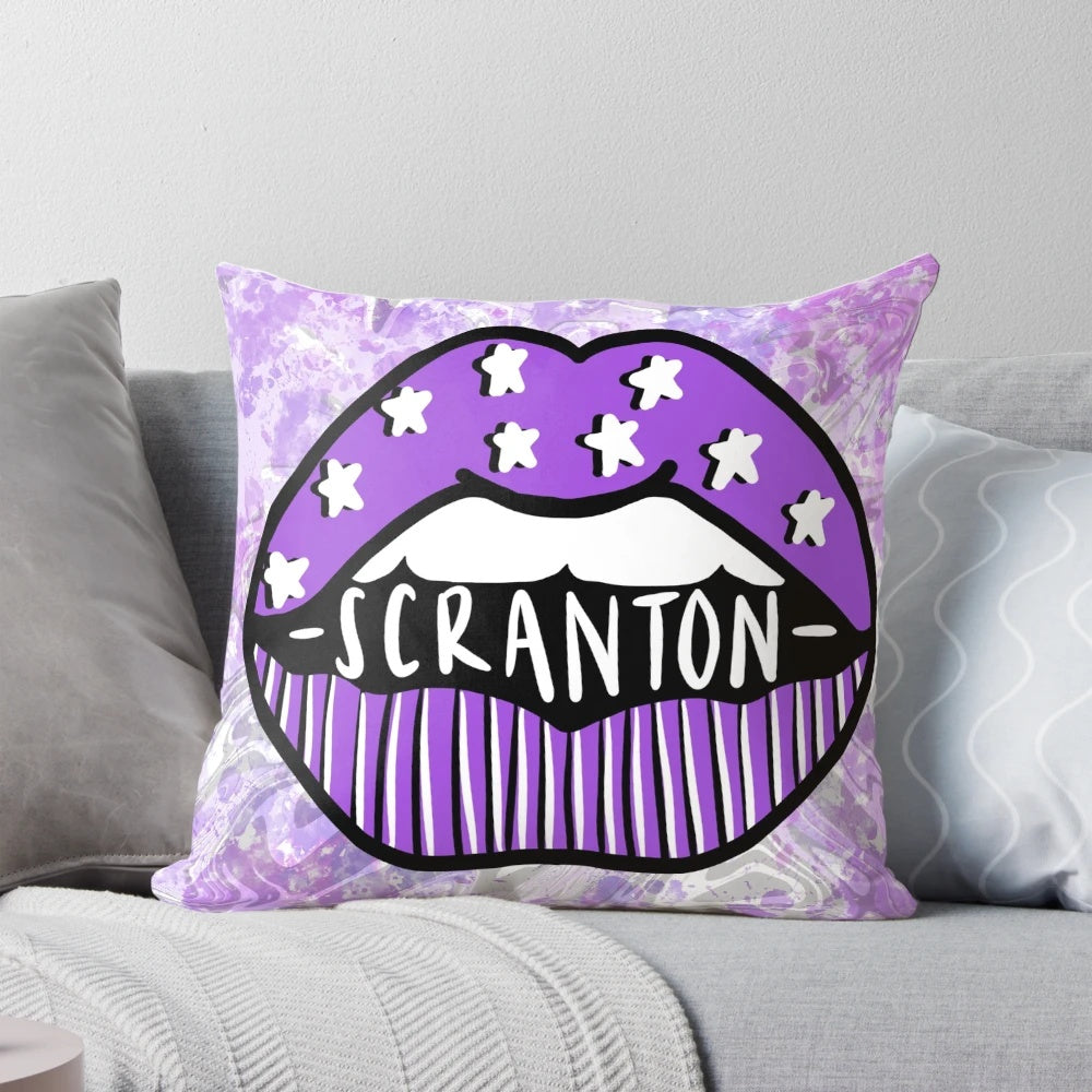 A vibrant tie-dye pillow featuring the Scranton Royals logo and purple lips, representing the University of Scranton in Pennsylvania.