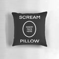 A black and white pillow with the word "SCREAM" printed on it, perfect for adding a touch of dark humor to your home.